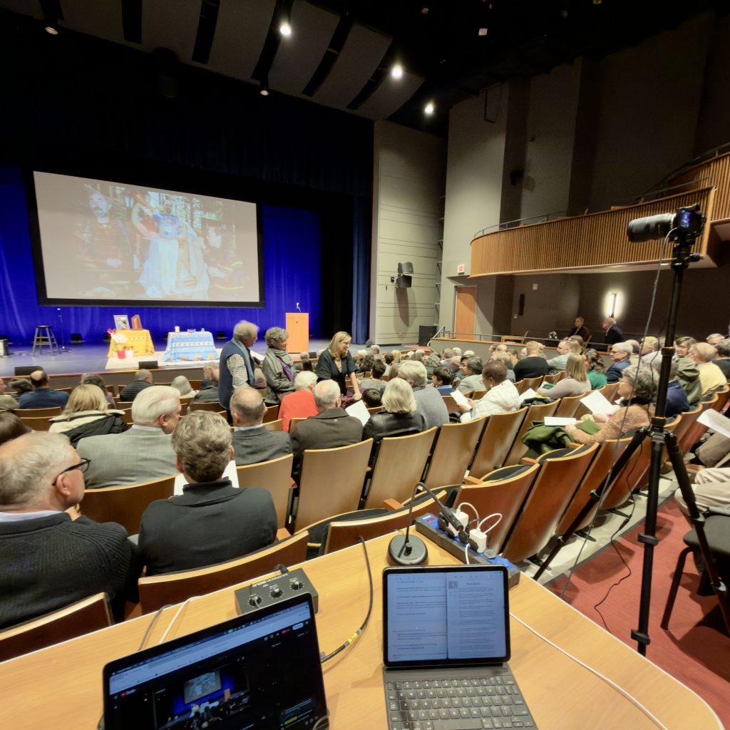 Gibson Creations live production setup with cameras and monitoring equipment at an auditorium event